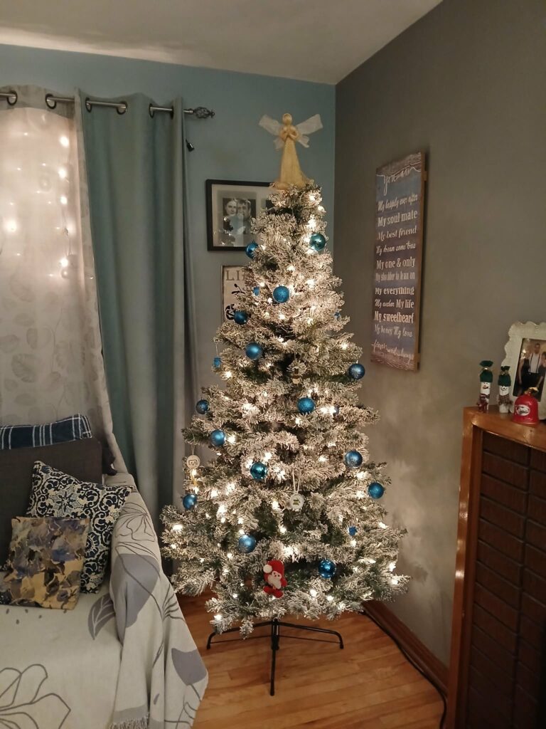 Christmas tree in a living room-at night - lights sparkling